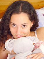 sexy cute teen jordan sits and plays with her stuffed animals